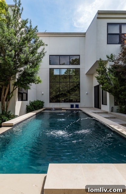 Exterior view of the two-story guest house with modern design and landscaping