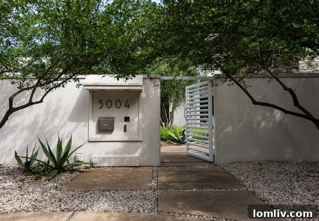 Exterior view of 5004 Abbott Avenue with lush landscaping and modern design