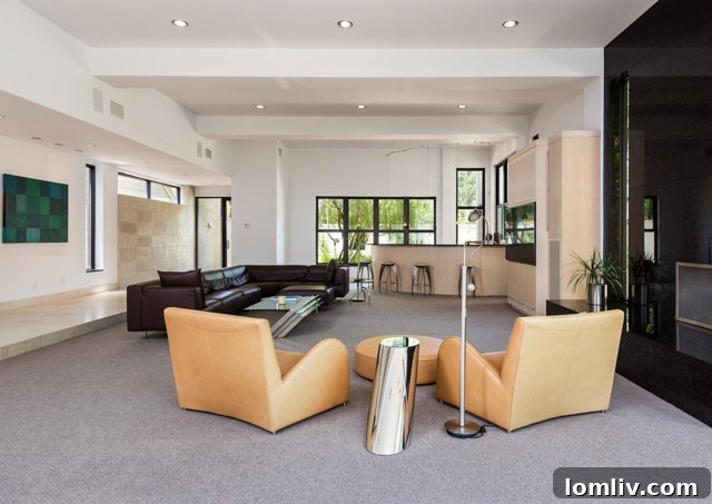 Open concept living area with a sleek integrated bar, perfect for entertaining