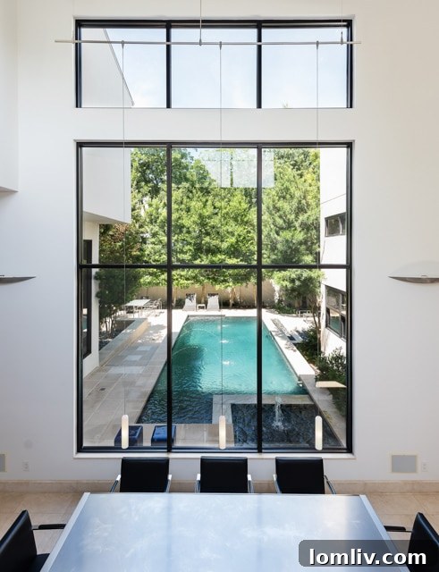 Elegant dining area with panoramic views overlooking the swimming pool