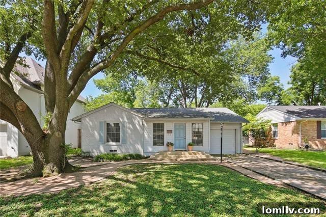 Charming Aqua Drive Cottage Front View with Lush Landscaping