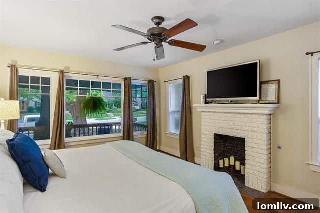 Spacious bedroom with large windows in Fort Worth home
