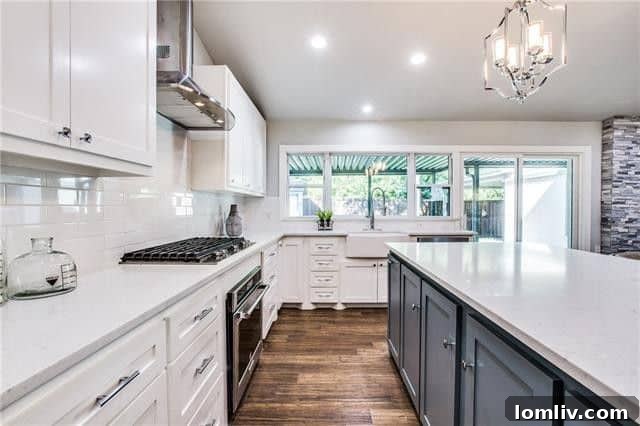 Elegant dining area adjacent to the kitchen with designer lighting.
