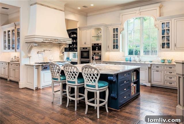 Opulent French Stone Manor Heads to No-Reserve Auction 7 Preston Hollow Remodeled Kitchen - Custom Cabinetry and Island