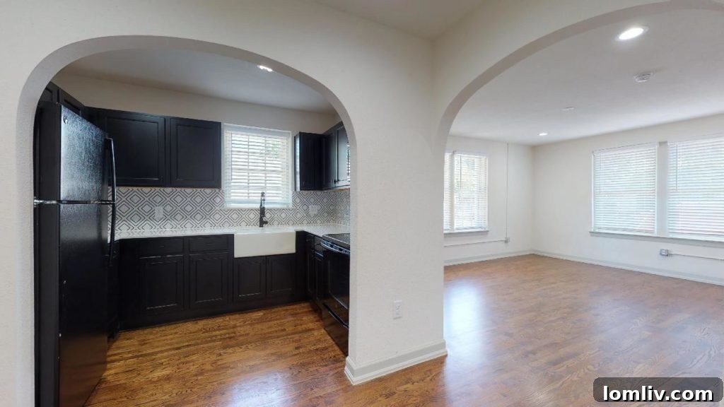 Interior of a beautifully restored one-bedroom apartment at Bella Villa, showcasing modern amenities and historic details in Dallas.