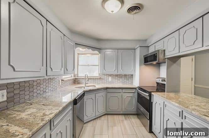 Bright Kitchen with Hexagonal Backsplash and Granite Countertops