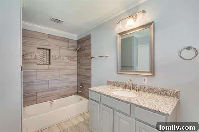 Stylish Bathroom with Modern Updates and Hardwood Flooring