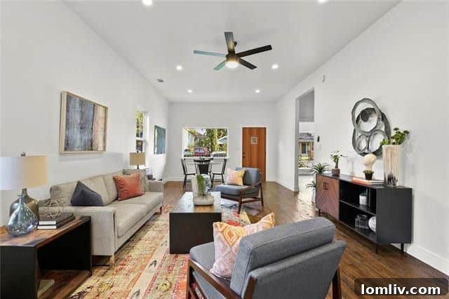 Bright and airy living room with original hardwood floors in a Dallas bungalow