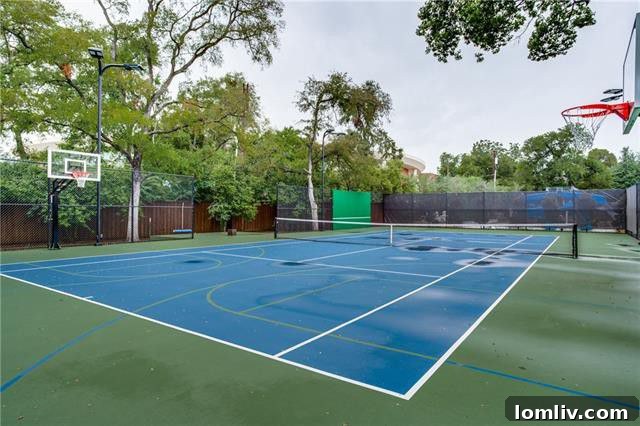 Fourth of July Luxury Unleashed: Preston Hollow's Transitional Party Estate 15 9807 Inwood Road - Impressive indoor basketball court within the versatile two-story garage