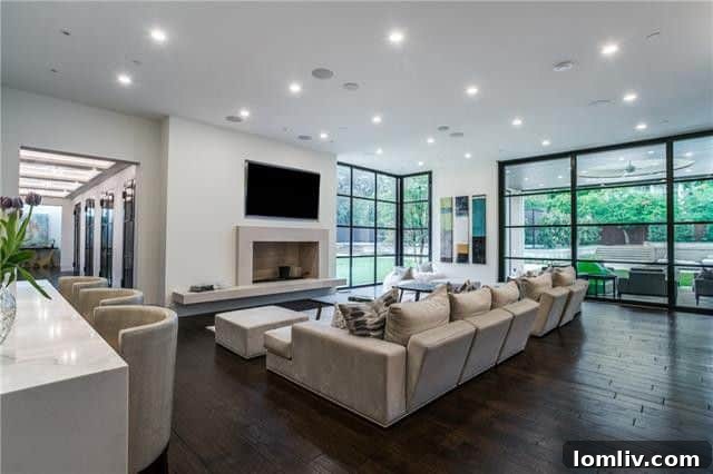 Fourth of July Luxury Unleashed: Preston Hollow's Transitional Party Estate 4 9807 Inwood Road - Elegant interior dining area with modern chandelier