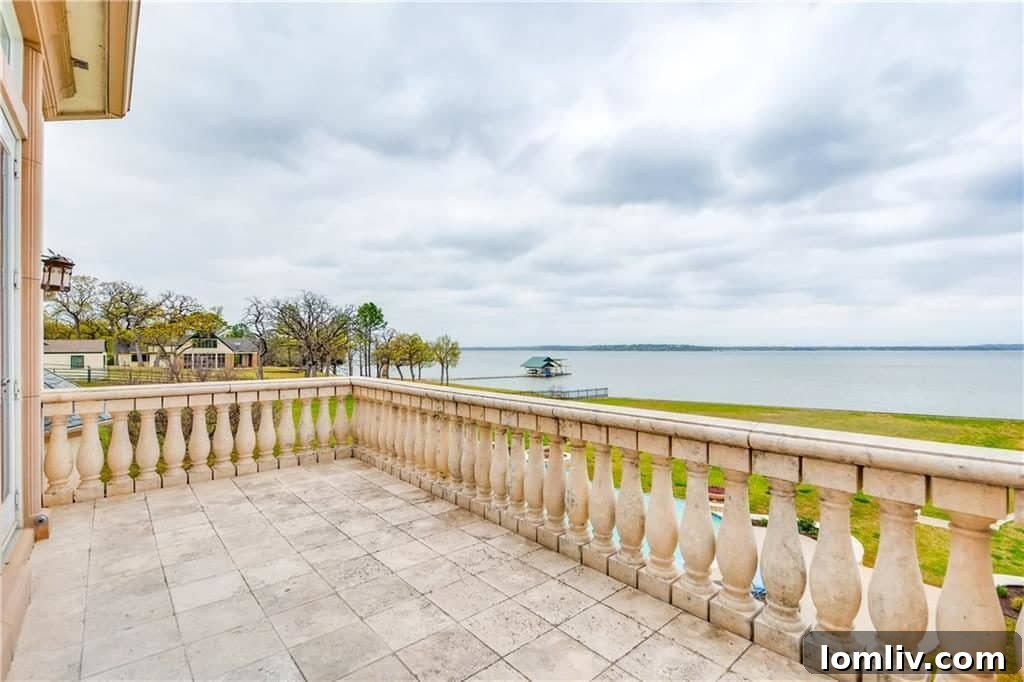 Master suite balcony with panoramic lake views at Azle luxury home