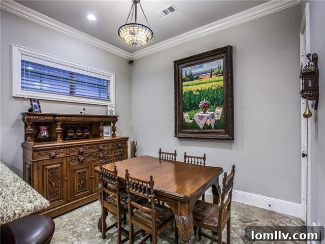 Bright and spacious dining area with hardwood floors in the Little Forest Hills Tudor home