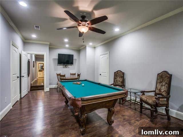 Modern kitchen with large island, stainless steel appliances, and ample counter space in the East Dallas Tudor