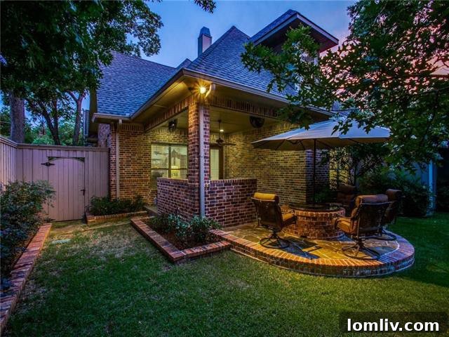Charming backyard view and outdoor living space of the 2020 Lakeland Drive Tudor home