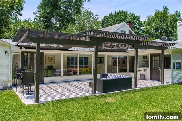 Bright and spacious living room with exposed beams and fireplace at 6308 Bryan Parkway.
