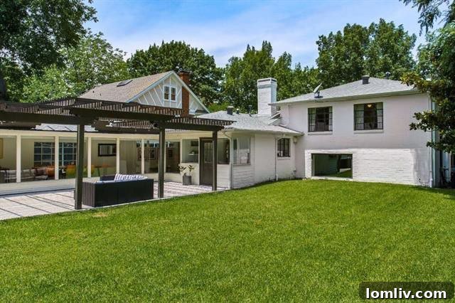 Spacious outdoor entertaining area with a large pergola at 6308 Bryan Parkway.