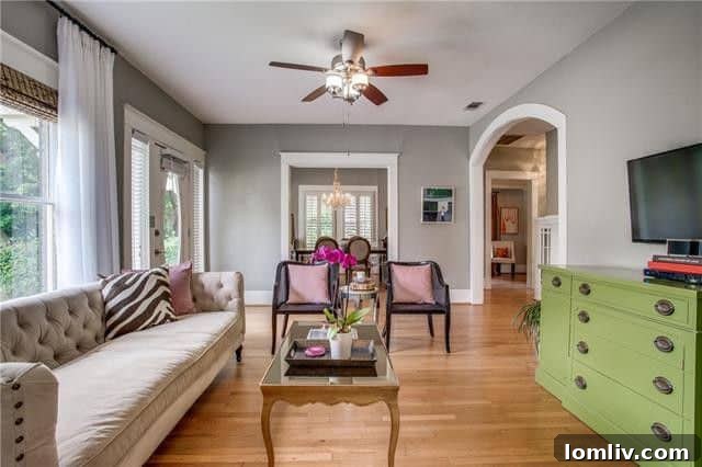 Cozy living room with original hardwoods and fireplace at 6103 Hudson Street.