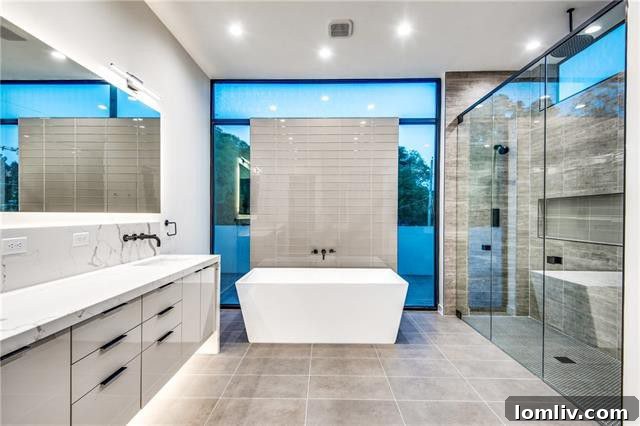 Spacious master closet featuring built-in organization and a dedicated laundry area
