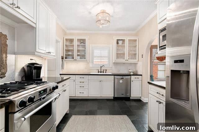 Bright and airy kitchen with stainless steel appliances and natural light