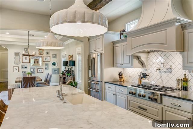 Detail view of luxurious marble countertops and a high-performance six-burner JenAir gas cooktop in the gourmet kitchen