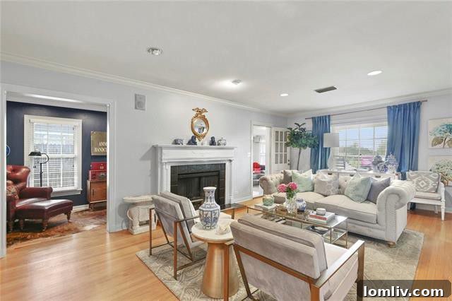 Spacious and bright living area featuring elegant wood flooring and ample natural light