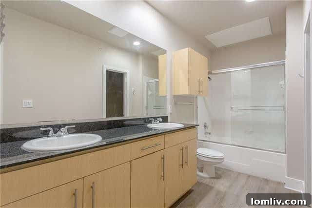 Spacious Bathroom with Garden Tub and Double Sink in Oak Lawn Condo