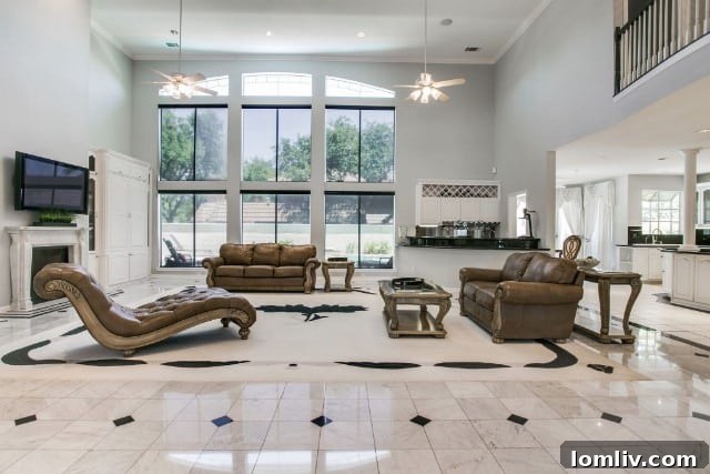 Grand marble foyer and formal living area with fireplace at 8580 Abrams Road