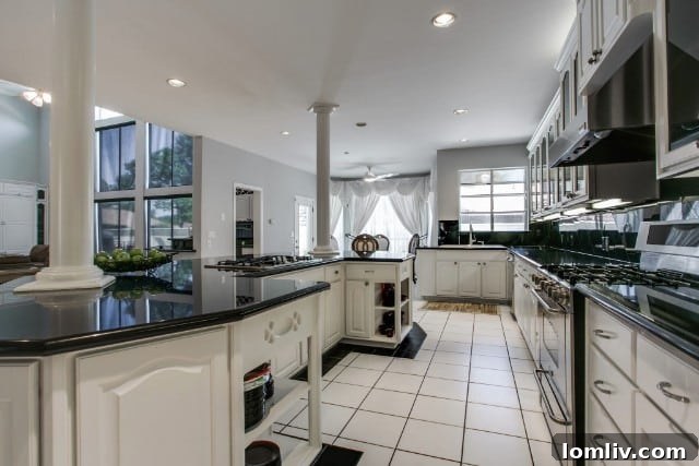 Spacious great room with two-story windows and built-in cabinetry, 8580 Abrams Road