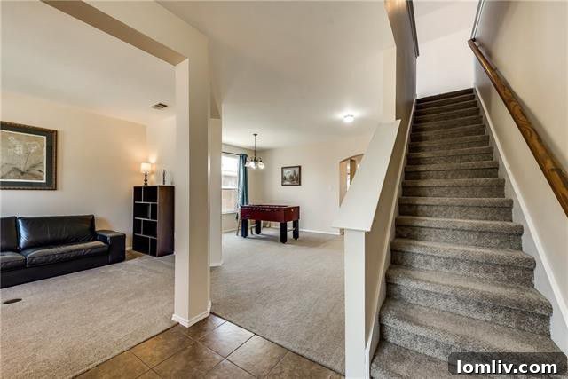 Spacious interior with multiple living areas in Fate home