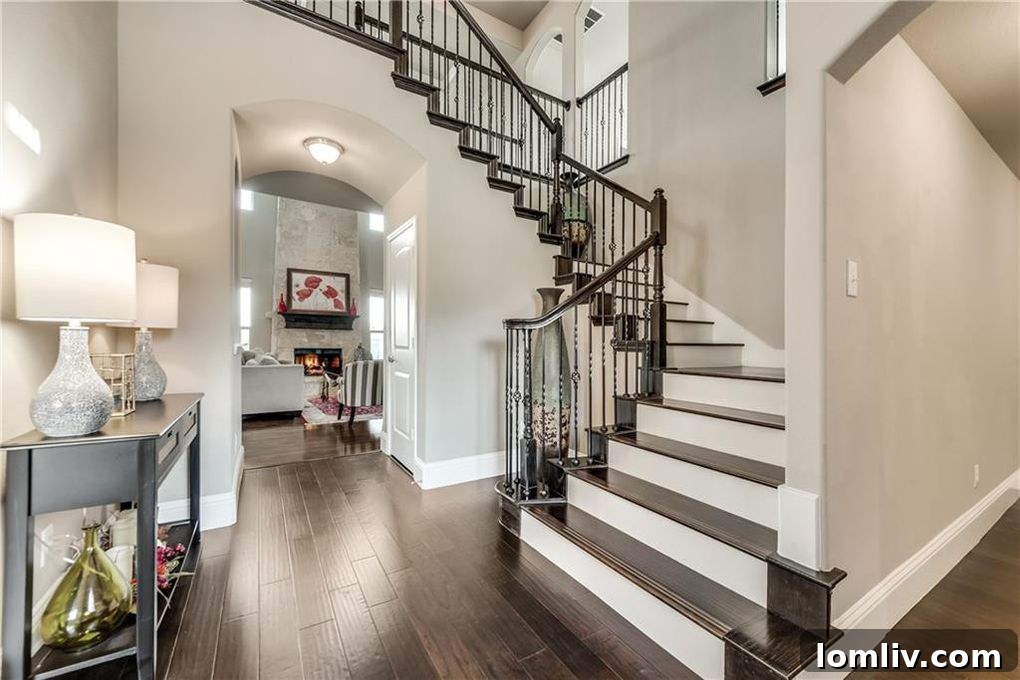 Spacious open-concept living room with fireplace in Fate home