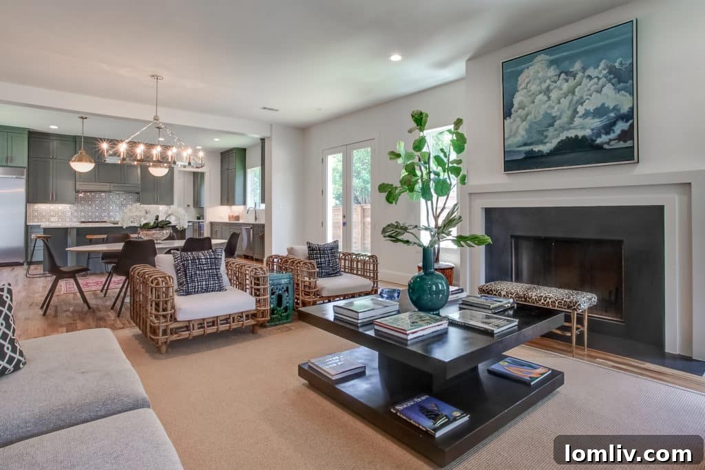 Interior view of the open concept living space at 700 N. Bailey, showcasing abundant natural light and sophisticated designer features, a hallmark of quality Fort Worth new construction.
