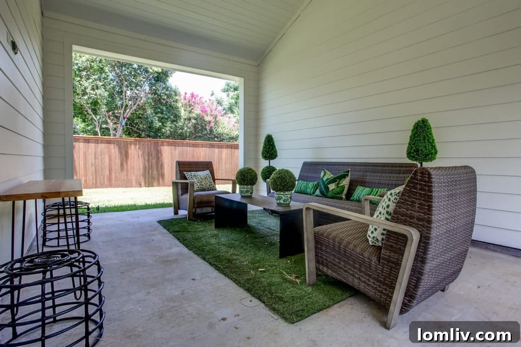 Architecturally designed wide breezeway connecting the detached garage and seamlessly integrating two distinct yard spaces at 700 N. Bailey, an innovative feature for Fort Worth corner lots.