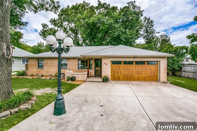 Exterior view of the well-maintained 1960s ranch-style home at 409 N. Morris Street in McKinney, featuring a charming facade and mature landscaping