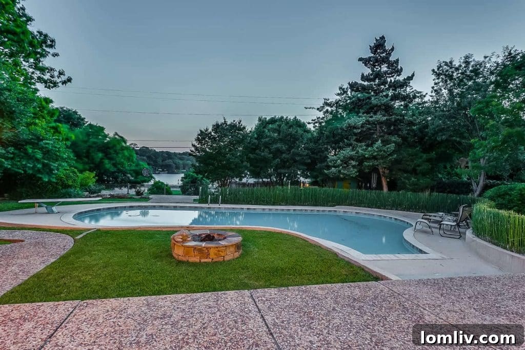 Midcentury Chic in Ridglea Hills Designed for Dazzling Gatherings 4 Peaceful backyard and pool at 4036 Tamworth Road, showcasing the tranquil view of Luther Lake.
