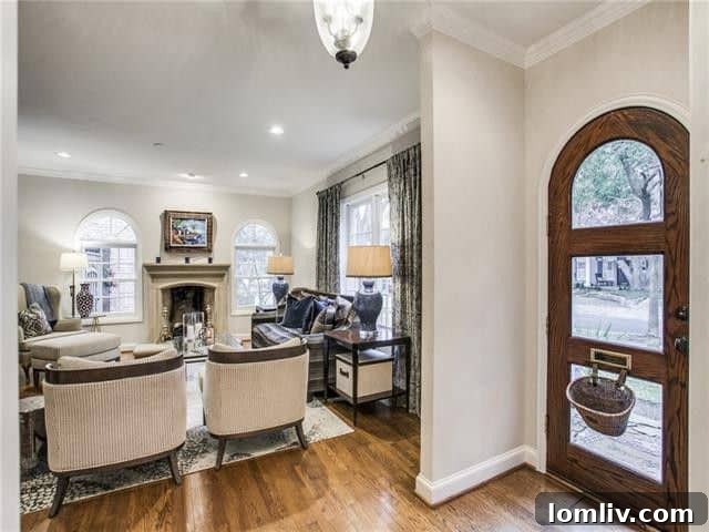 Spacious Living Area with Classic Archways and Hardwood Floors