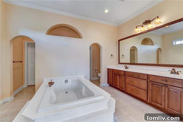 Spacious kitchen with granite countertops and double ovens in Rockwall luxury house