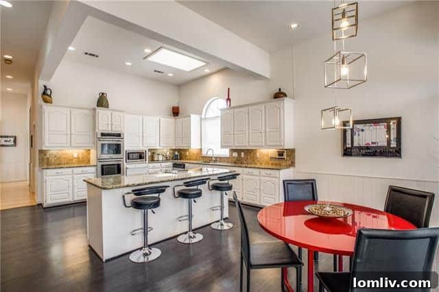 Spacious Oak Cliff Contemporary: Built for Bliss, Designed for Downtime 6 A spacious and well-appointed gourmet kitchen with rich espresso-stained wood floors and a bright adjoining breakfast area at 731 Kessler Lake Drive.