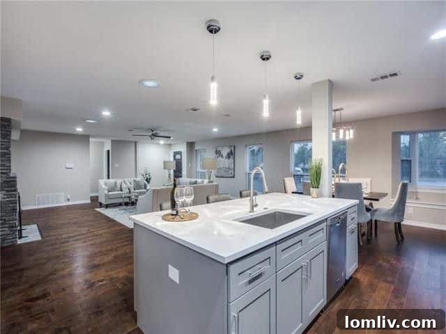 Modern chef's kitchen with stainless steel appliances and quartz counters in 5605 Northaven Road