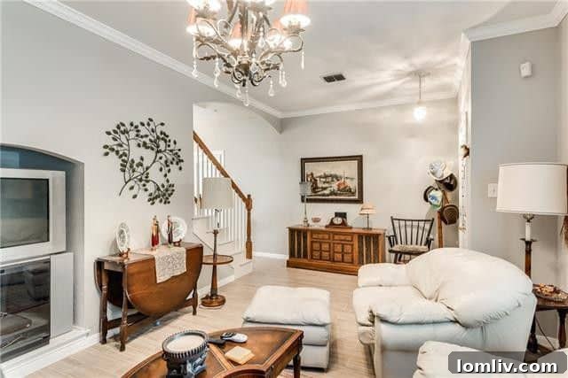 Bright living area with large windows, providing abundant natural light in the affordable duplex home.