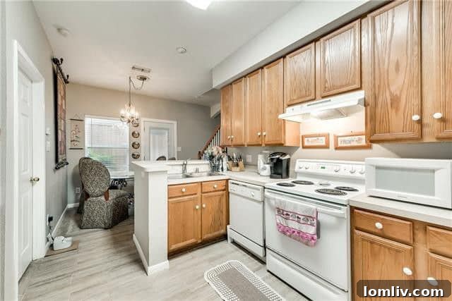Functional kitchen space with plenty of cabinetry and a breakfast nook, ideal for everyday dining.