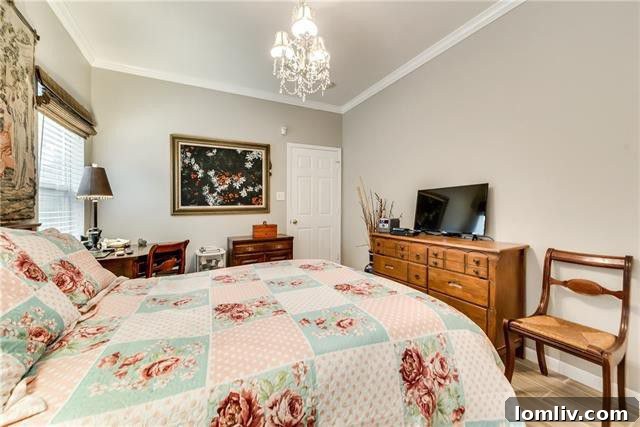 Comfortable bedroom with neutral decor and good natural lighting, suitable for various uses.
