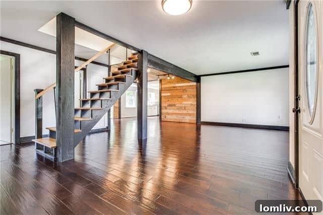 Modern kitchen with updated cabinetry, granite countertops, and stainless steel appliances in the Starter Home.