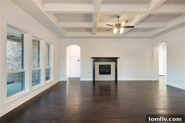 Bright and airy open concept living space with high ceilings and stunning hardwood floors in the new construction home.
