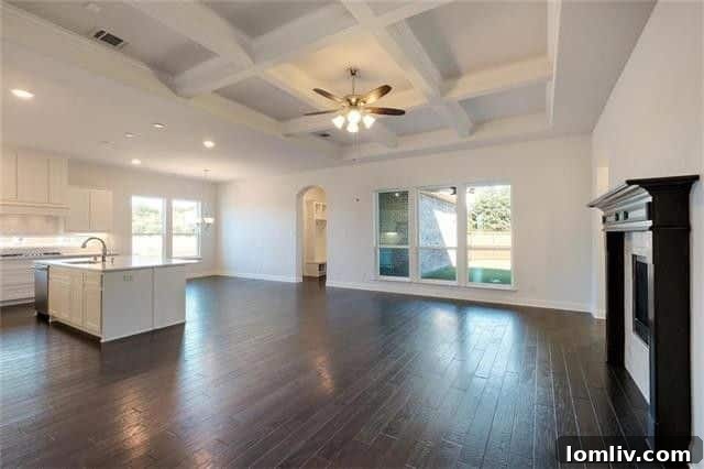 Sleek designer kitchen featuring a large island, stainless steel appliances, and ample cabinet space, perfect for gourmet cooking.
