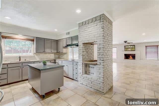Gourmet kitchen at 5909 Monterrey Lane featuring updated appliances, ample cabinetry, and a mobile island