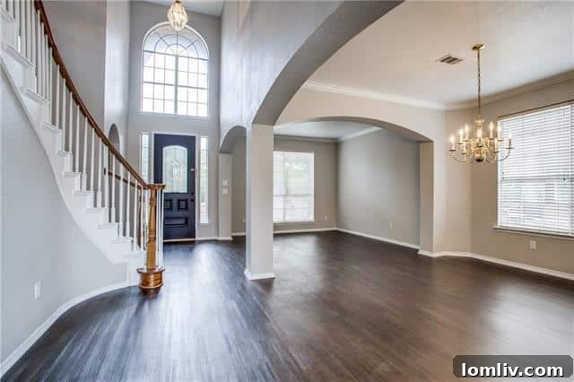 Spacious living room with elegant fireplace in Fairwood Drive home