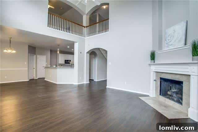 Modern kitchen with white cabinets, granite, and subway tile
