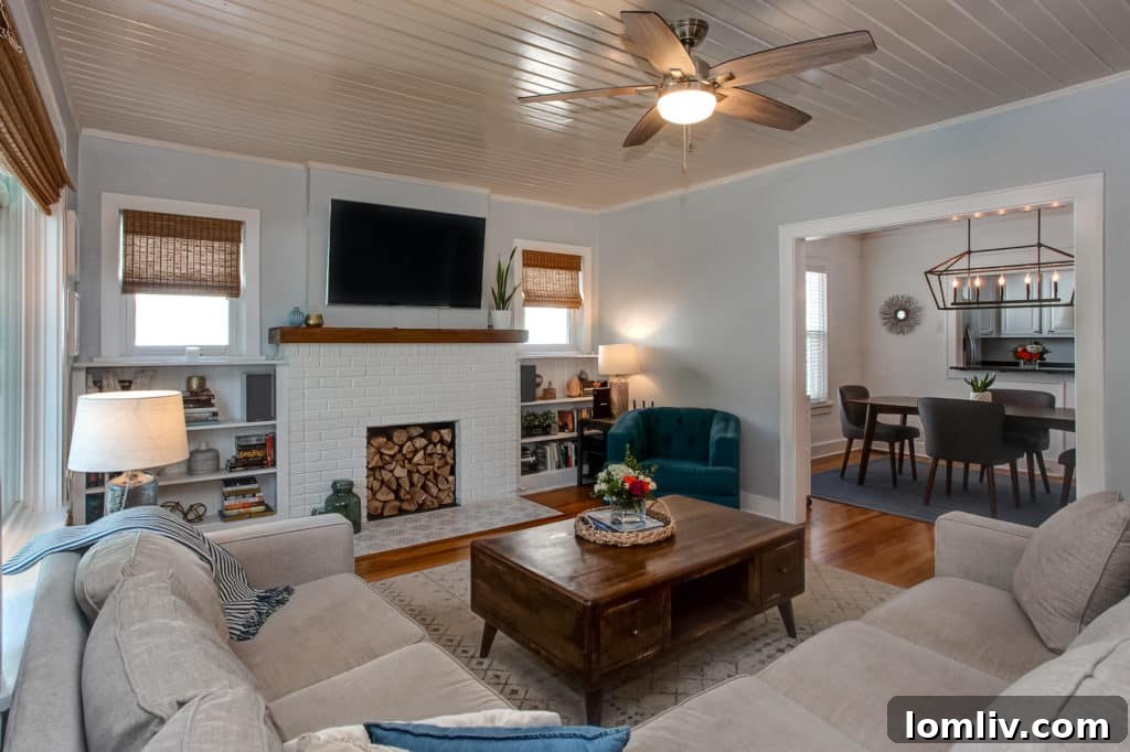 Family room with wooden plank ceiling, combining classic comfort with a crisp, modern aesthetic.