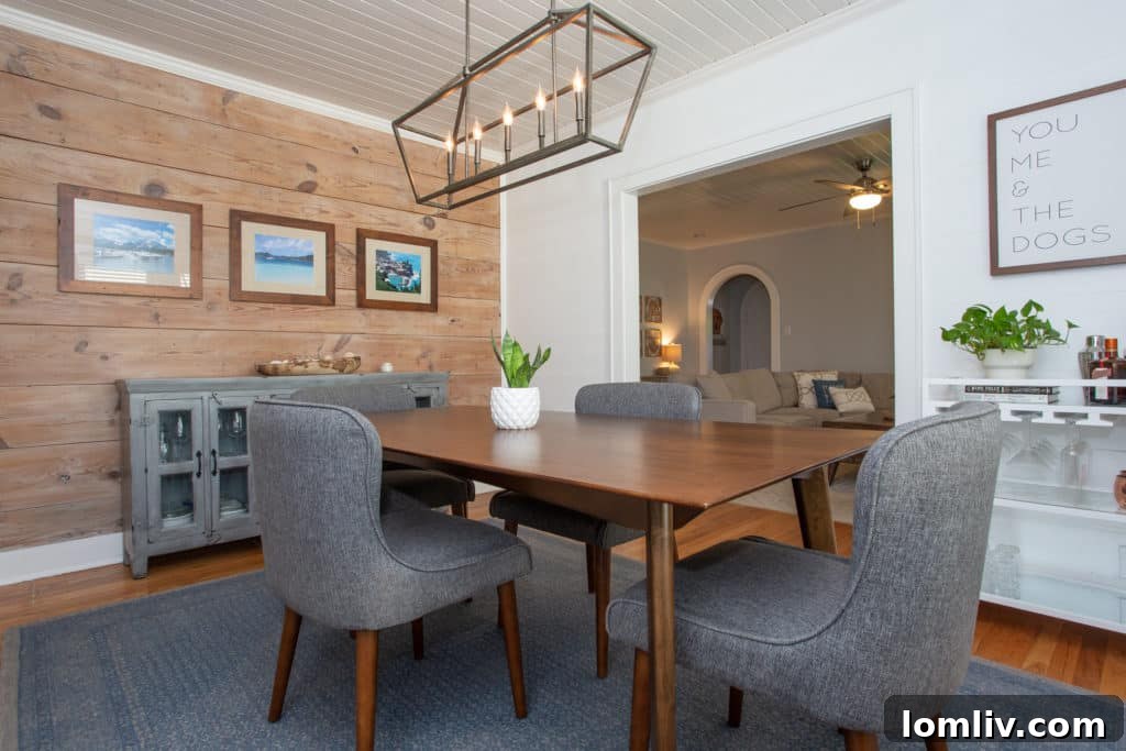 Dining area featuring essential shiplap detailing, adding rustic charm to the modern interior.
