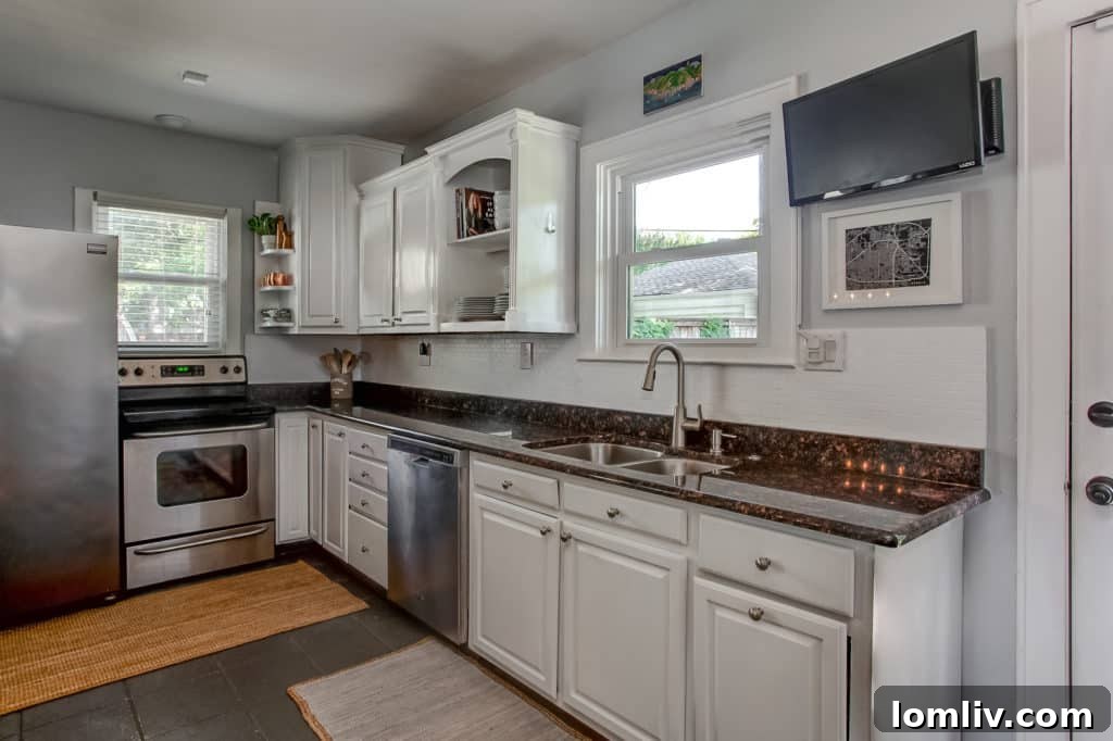 Updated kitchen with abundant natural light and expansive counter space, perfect for cooking and entertaining.